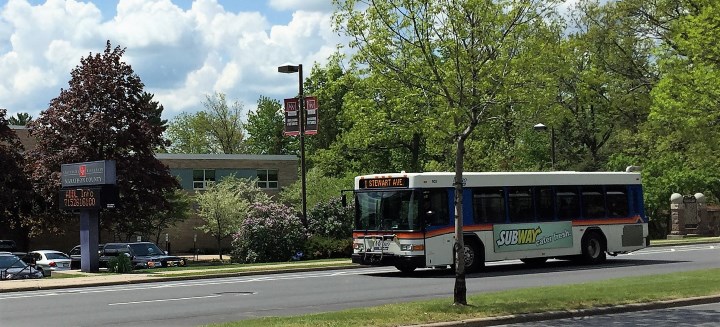 Bus driving down a street