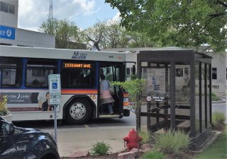 Person walking onto the bus